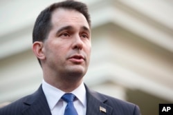FILE - Under Governor Scott Walker, Wisconsin has implemented a strict voter ID law.