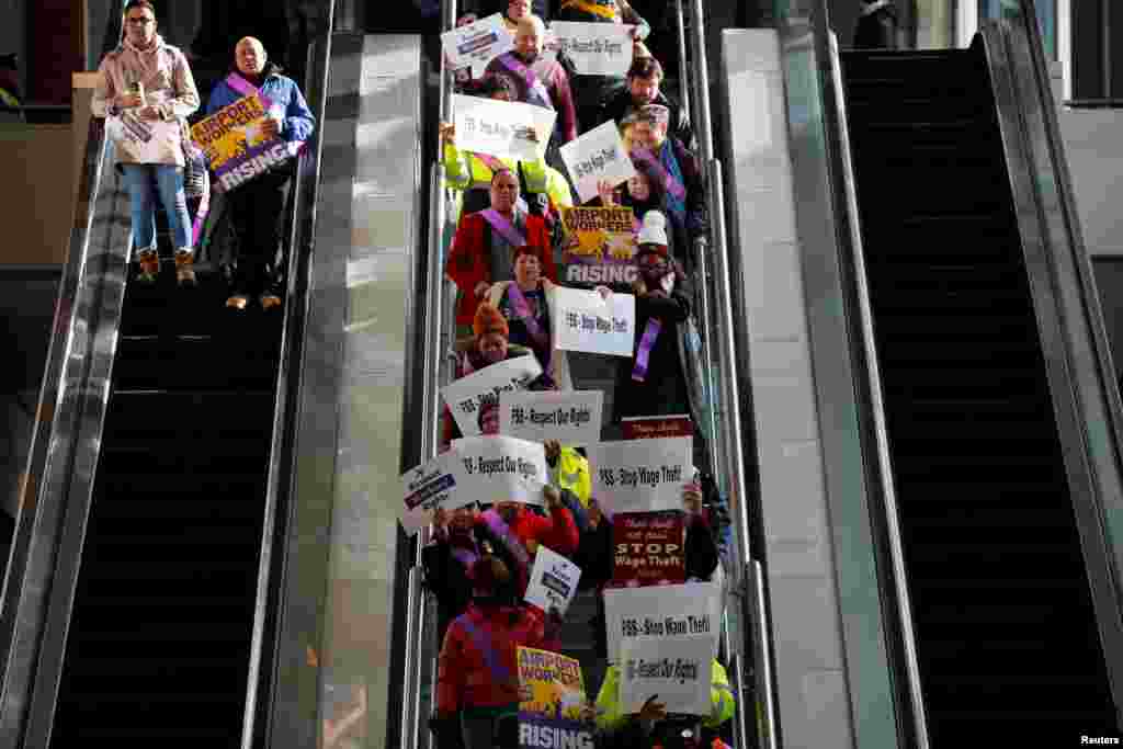 Union workers and airport employees arrive for a rally for federal government employees working without pay and workers trying to unionize at Logan Airport in Boston, Massachusetts, Jan. 21, 2019.
