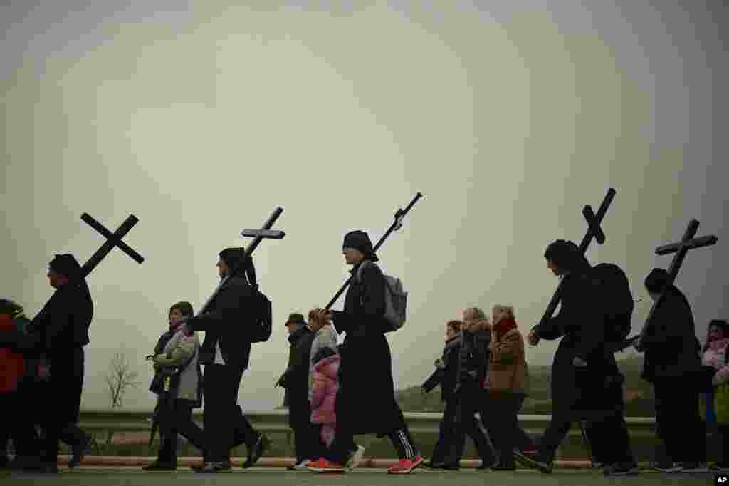 Catholic penitents of the Ujue Virgin take part in a pilgrimage from Tafalla and other villages to the small town of Ujue, northern Spain.