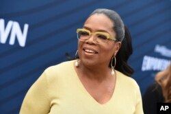 FILE - Oprah Winfrey arrives at THR's Empowerment in Entertainment Gala at Milk Studios, April 30, 2019, in Los Angeles.