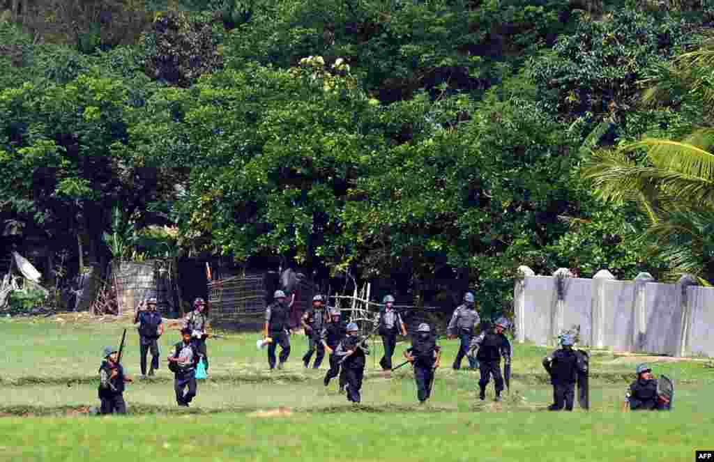 Security forces try to restore order in Rakhine state, Burma, after a wave of deadly religious violence, as the United Nations evacuated foreign workers, June 11, 2012.