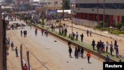 FILE - Anti-government demonstrators block a road in Bamenda, Cameroon, Dec. 8, 2016. A military tribunal in Cameroon has denied bail to two civil society leaders accused of directing violent unrest in the northwest and the southwest in December. 