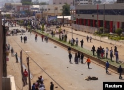 FILE - Anti-government demonstrators block a road in Bamenda, Cameroon, December 8, 2016.