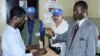 Man votes as UN observers look on in Bangui, Central African Republic