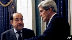 အမေရိကန်နိုင်ငံခြားရေးဝန်ကြီးကယ်ရီ (ယာ) နဲ့ အီရတ်ဝန်ကြီးချုပ် နိုရီအယ်လ်မလိခီ ဘက်ဂဒက်မှာ တွေ့ဆုံစဉ်။ (မတ်လ ၂၄ ရက်၊ ၂၀၁၃)