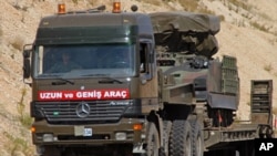 A Turkish military truck transports a mobile missile launcher to the Syrian border, near Kilis, Turkey, June 28, 2012.(AP).