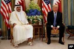 U.S. President Donald Trump, right, holds a bilateral meeting with Qatar's Emir Sheikh Tamim Bin Hamad Al-Thani, in Riyadh, Saudi Arabia, May 21, 2017.
