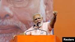 India's Prime Minister Narendra Modi addresses an election campaign rally ahead of the Karnataka state assembly elections in Bengaluru, India, May 8, 2018.