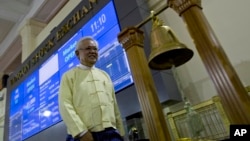 Serge Pun executive chairman of First Myanmar Investment walks as electronic trading commences during the opening day of trading at Yangon Stock Exchange in Yangon, Myanmar, March 25, 2016. 