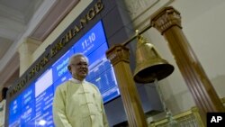 Serge Pun executive chairman of First Myanmar Investment walks as electronic trading commences during the opening day of trading at Yangon Stock Exchange in Yangon, Myanmar, March 25, 2016. 