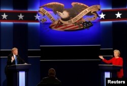 Republican U.S. presidential nominee Donald Trump and Democratic U.S. presidential nominee Hillary Clinton speak at their first presidential debate at Hofstra University in Hempstead, New York, U.S., September 26, 2016.