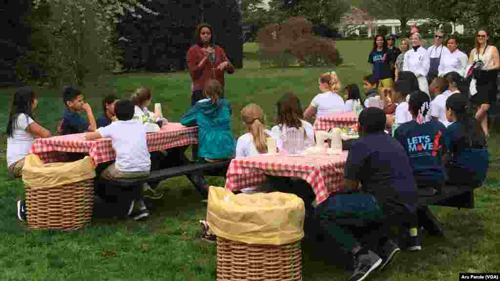 First lady Michelle Obama speaks to students about Let’s Move! on the South Lawn before planting the White House kitchen garden planting, April 15, 2015.