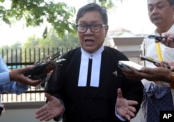 Khin Maung Zaw, a lawyer of two Reuters journalists, Wa Lone and Kyaw Soe Oo, talks to journalists as he leaves the Supreme Court in Naypyitaw, Myanmar, March 26, 2019.