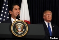 Japanese Prime Minister Shinzo Abe delivers remarks on North Korea accompanied by U.S. President Donald Trump at Mar-a-Lago club in Palm Beach, Florida, Feb. 11, 2017.
