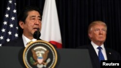 Japanese Prime Minister Shinzo Abe delivers remarks on North Korea accompanied by U.S. President Donald Trump at Mar-a-Lago club in Palm Beach, Florida, Feb. 11, 2017.