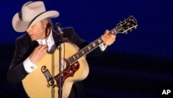 Dwight Yoakam performing at a music awards ceremony in June