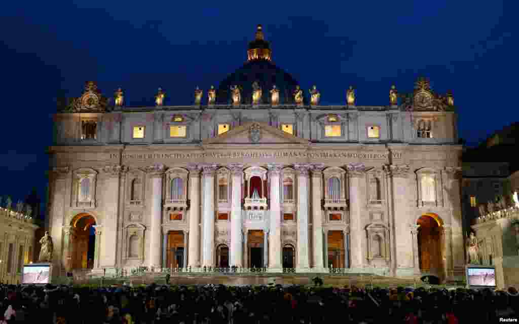 The crowd waits during the conclave in Saint Peter's Square at the Vatican, March 12, 2013.