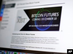 This Friday, Dec. 8, 2017, photo shows the Chicago Board Options Exchange website announcing that bitcoin futures will start trading on the CBOE on Sunday evening, Dec. 10.