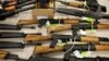 FILE - A cache of seized weapons is displayed in Phoenix, Jan 25, 2011.