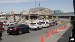 Vehicles from Mexico and the U.S. approach a border crossing in El Paso, Texas, Monday, April 1, 2019. (AP Photo/Cedar Attanasio)