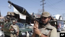 Pakistan army soldiers are on alert at the site of a bombing in Shabqadar near Peshawar, Pakistan (File Photo)