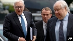 Russian Deputy Foreign Minister Sergei Ryabkov, left, and Russian Ambassador to the U.S. Sergey Kislyak, right, arrive at the State Department in Washington, July 17, 2017, for talks with Undersecretary of State Thomas Shannon.