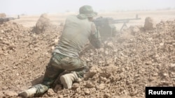 A member of the Shi'ite Badr Organization undergoes training before the upcoming battle to recapture Mosul in Diyala province, Iraq, Sept. 27, 2016.