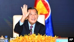 FILE - In this photo provided by the An Khoun Sam Aun/National Television of Cambodia, Cambodian Prime Minister Hun Sen joins an online meeting of the ASEAN-China special summit at Peace Palace in Phnom Penh, Cambodia, Nov. 22, 2021. 