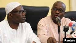 (L-R) Lateef Aderemi Ibirogba, Lagos' State Commissioner for Information and Strategy, sits with Dr. Jide Idris, the Commissioner for Health, during a news conference on the death of an Ebola victim in Lagos, July 25, 2014. 