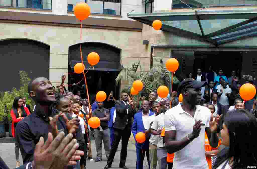 Workers at the DusitD2 Hotel celebrate during its reopening. It was closed following an attack by Al-Shabaab-affiliated militants that killed at least 21 people in Nairobi, Kenya.