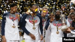 U.S. players celebrate winning their Basketball World Cup final game against Serbia in Madrid Sept. 14, 2014.