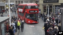 Double decker bus approaches London's Victoria Station.