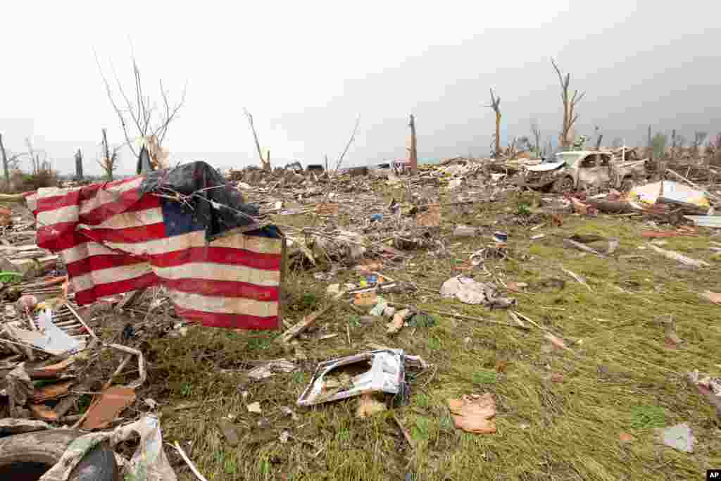 Piles of debris is all that's left to homes located off Cemetery Street in Vilonia, Arkansas, after a tornado struck the town, April 28, 2014. 