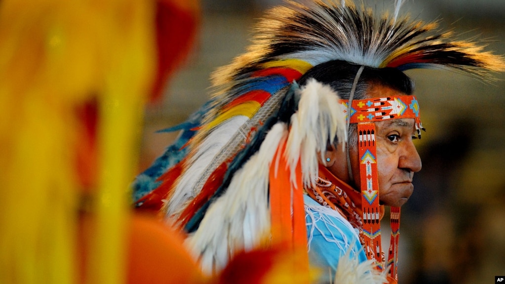 Butch McIntosh wears traditional Native American regalia at the Pow Wow of Champions on the fairgrounds in Tulsa, Okla. Saturday Aug. 11, 2007. 