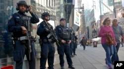 Officers from the New York Police Department's anti-terror unit patrol Times Square, Nov. 4, 2016. Police and the FBI are assessing information they received of a possible al-Qaida terror attack against the U.S. on the eve of Election Day.