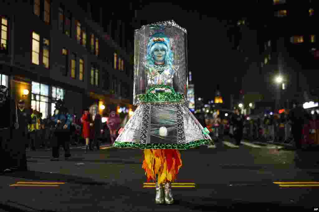 A reveler takes part in the Greenwich Village Halloween Parade, Oct. 31, 2018, in New York.