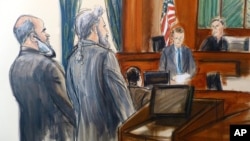 FILE - In this courtroom sketch, from left, Suleiman Abu Ghaith stands next to his attorney, Stanley Cohen, as courtroom deputy Andrew Mohan, reads the verdict and Judge Lewis Kaplan, right, listens, March 26, 2014 at federal court in New York.
