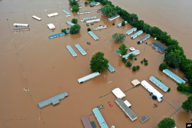 Homes are flooded along the Arkansas River in Sand Spring, Okla., May 28, 2019.