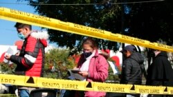 People line up to be tested for COVID-19, in the Benito Juarez borough of Mexico City, Jan. 15, 2022.