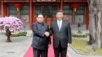 Lãnh tụ Kim Jong Un bắt tay Chủ tịch Tập Cận Bình ở Bắc Kinh.