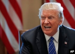 President Donald Trump speaks in the Cabinet Room of the White House in Washington, Sept. 12, 2017.