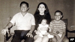 The author - Maya Soetoro-Ng - as a baby and her brother, Barack Obama, with their mother, Ann Dunham, and her father, Lolo Soetoro, in an undated family snapshot.