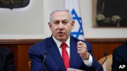 FILE - Israeli Prime Minister Benjamin Netanyahu chairs the weekly cabinet meeting in Jerusalem, April 14, 2019.