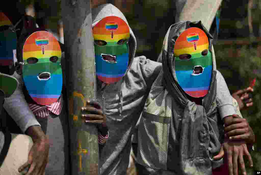 Kenyan gays and lesbians and others supporting their cause wear masks to preserve their anonymity as they stage a rare protest, against Uganda&#39;s increasingly tough stance against homosexuality and in solidarity with their counterparts there, outside the Uganda High Commission in Nairobi.