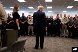 President Donald Trump and first lady Melania Trump meet with first responders at the Las Vegas Metropolitan Police Department, Oct. 4, 2017, in Las Vegas.