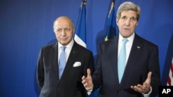 U.S. Secretary of State John Kerry, right, and French Foreign Affairs Minister Laurent Fabius give a press conference following talks at the Quai d'Orsay in Paris Wednesday Nov. 5, 2014. 