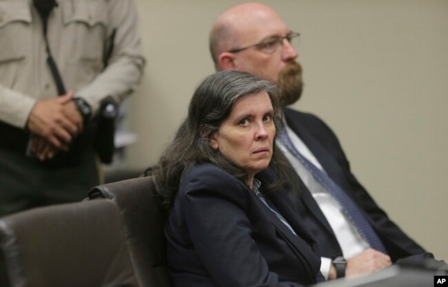 FILE - Louise Turpin and her attorney, Jeff Moore, appear in court for a conference about their case in Riverside, Calif., Feb. 23, 2018.