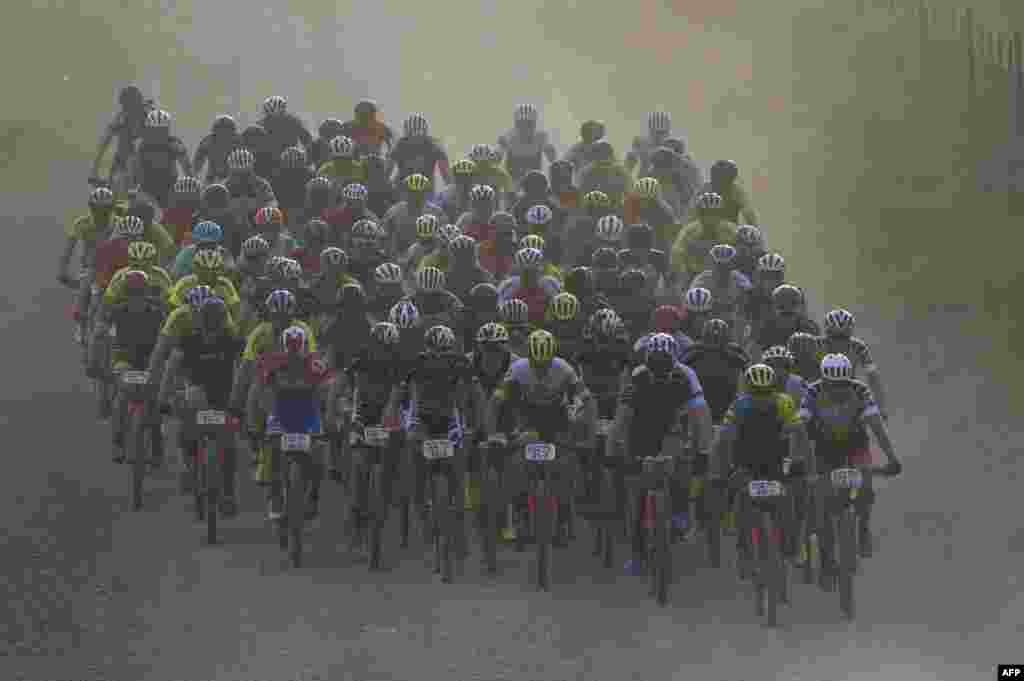 The leading pack of professional riders ride during the first full stage of the 2018 Cape Epic African Mountain Bike Race in the mountainous region around the town of Robertson, about 150Km from Cape Town, South Africa.