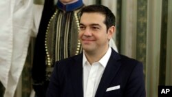 Greece's Prime Minister Alexis Tsipras attends his cabinet's swearing in ceremony at the presidential palace in Athens, Sept. 23, 2015. 