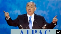 Israeli Prime Minister Benjamin Netanyahu gestures while speaking at the 2015 American Israel Public Affairs Committee (AIPAC) Policy Conference in Washington, D.C., March 2, 2015.